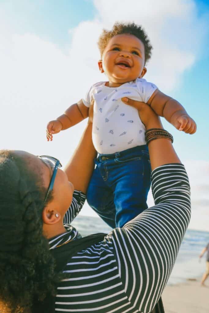Photo of a mother and son on the beach; names that mean sand are beautiful